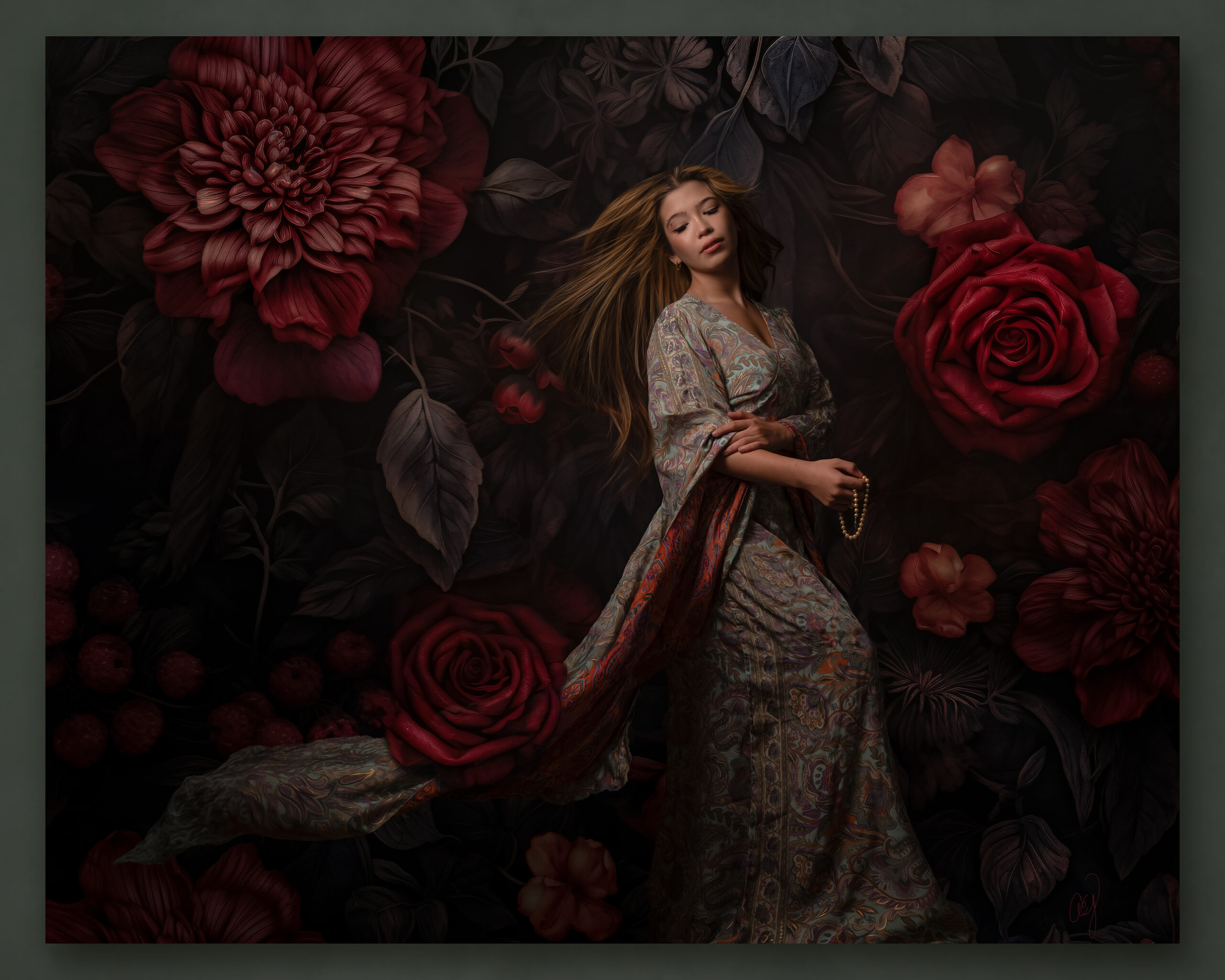 The same senior finished as a fine-art composite, framed by oversized dark roses and blossoms.